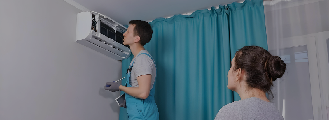 HVAC technician carrying out routine air conditioning service in a Melbourne home.